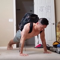 Bent arm handstand press related exercise weighted push-up with backpack